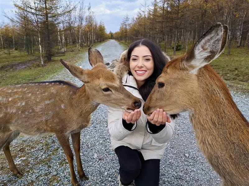 Emily with deer in nature